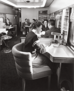Woman writes at a desk